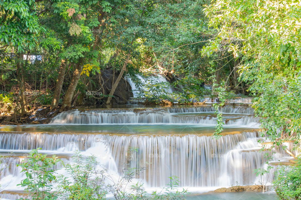 Waterfall flowing from the mountains at Huay Mae khamin waterfall National Park ,Kanchana buri in Thailand.