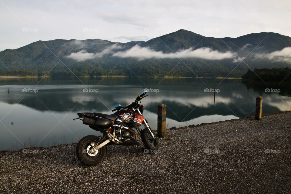 motorcycle at lake in autumn