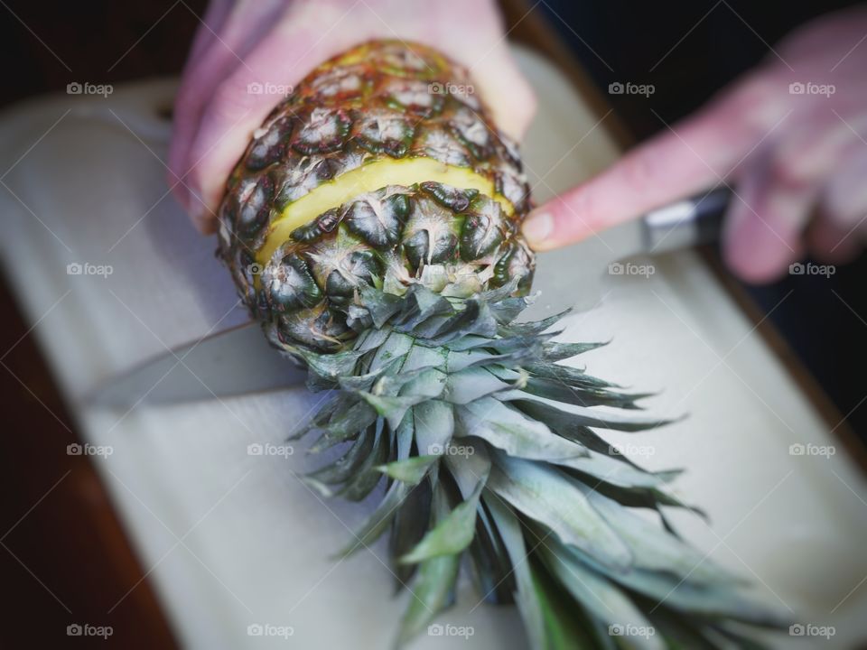 Slicing pineapple