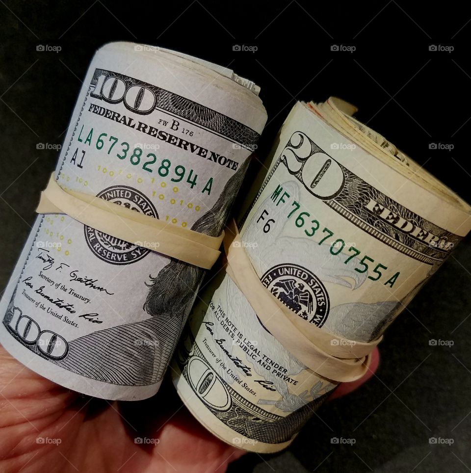 Rolled up U.S. paper currency.
