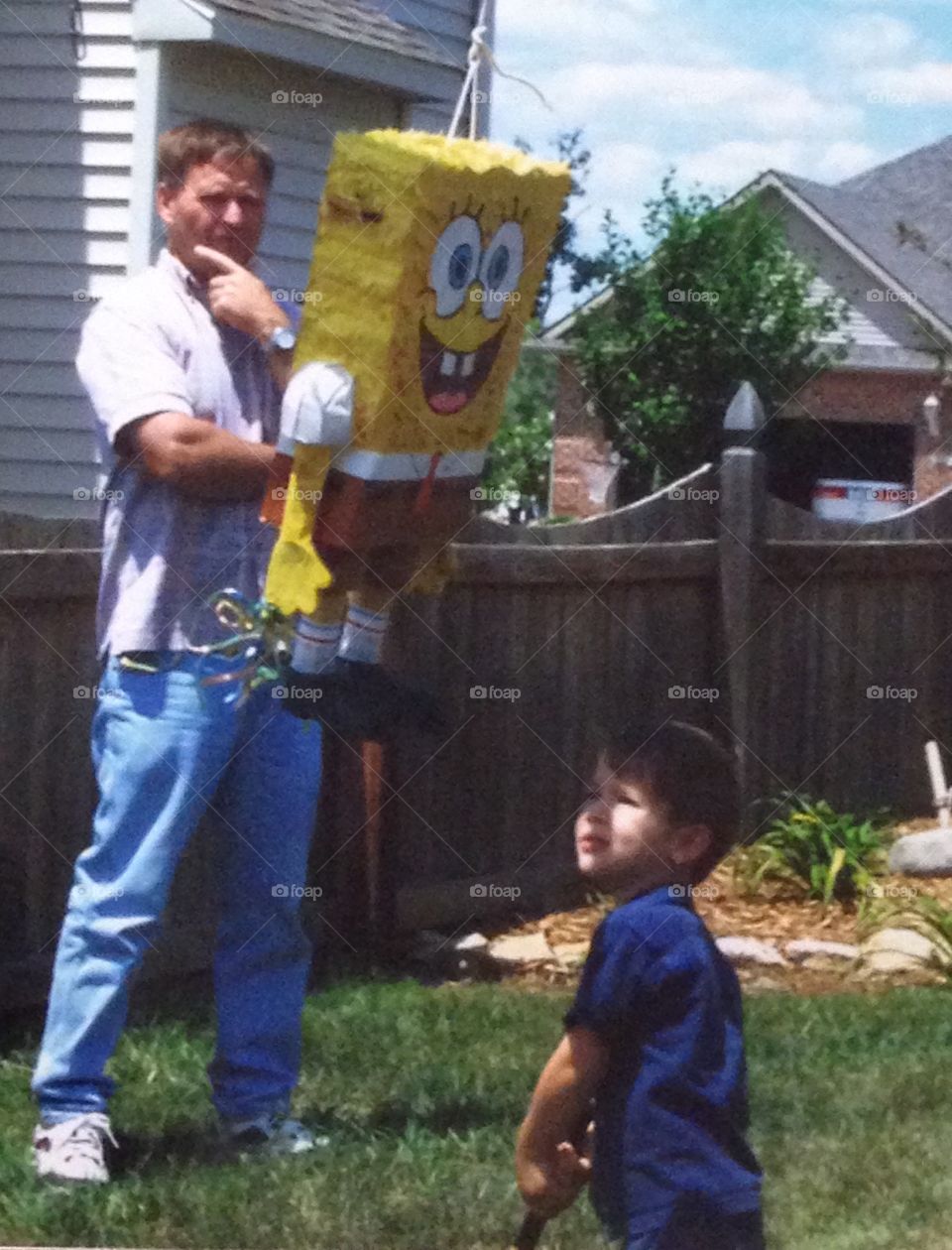 Super dad stationed at the piñata 