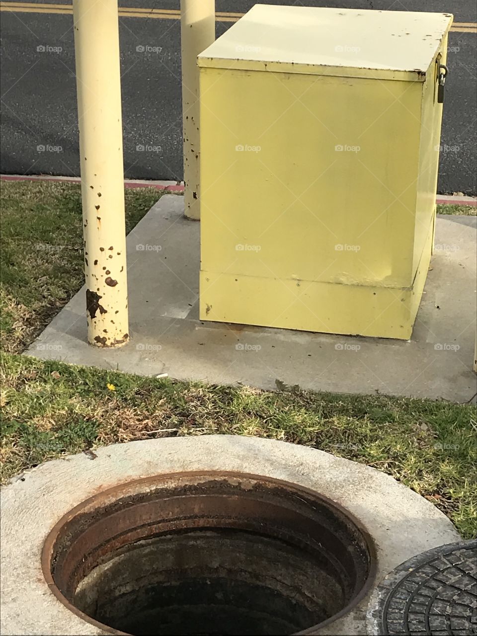 Open manhole street view of sewer