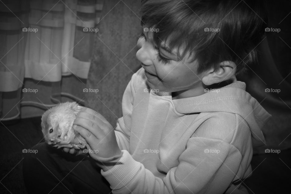 boy holding a mouse
