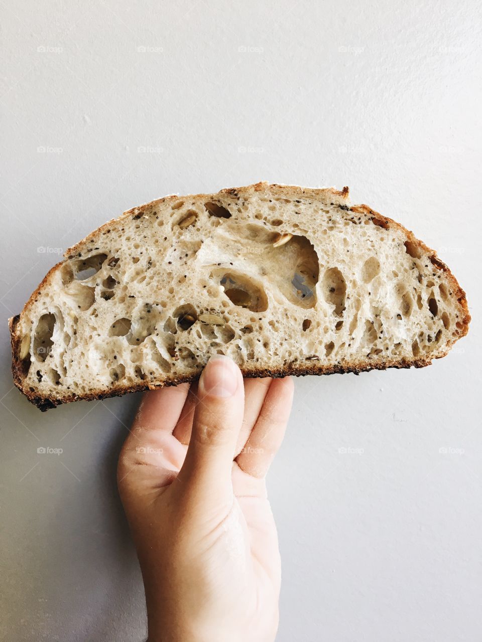 Woman hand holding bread