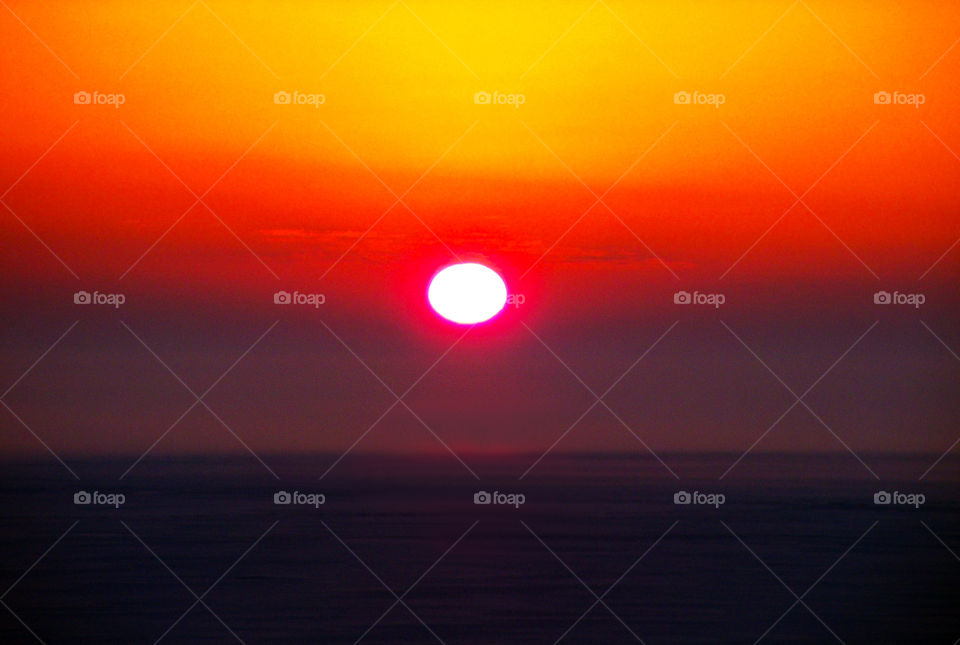 psychadelic sunrise. bright orange and red sunrise