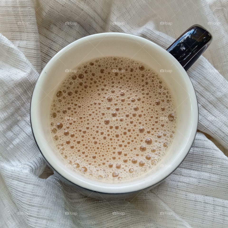 Relax moments ..A mug  of milk tea.
