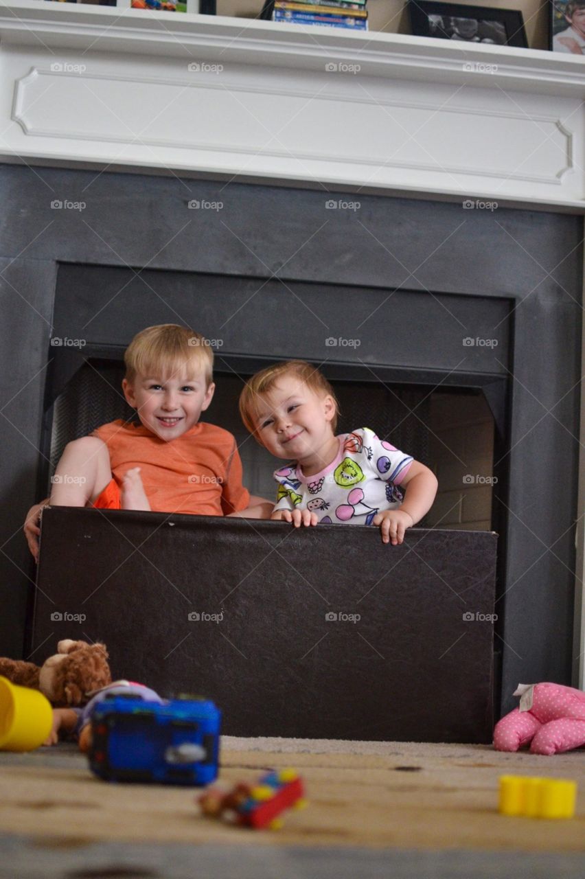 Two kids and a toy box 