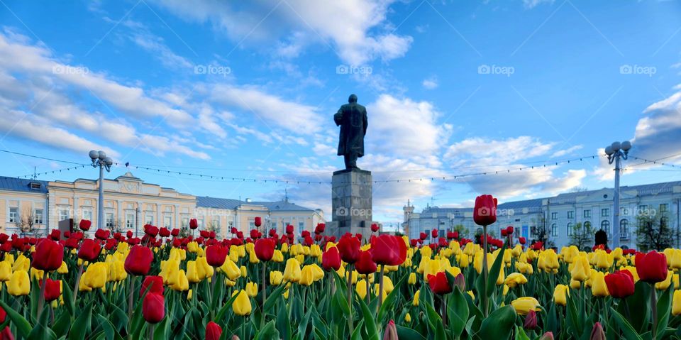 Monument of Lenin in a field of flowers