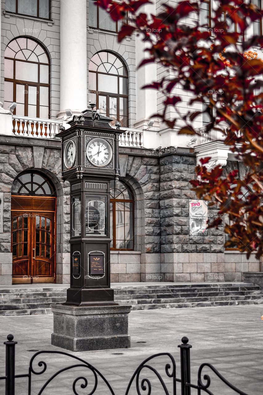 Autumn season town square with clock tower