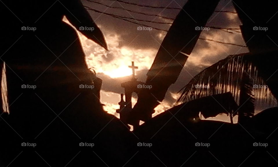 strange light of sunset at the cross of the church