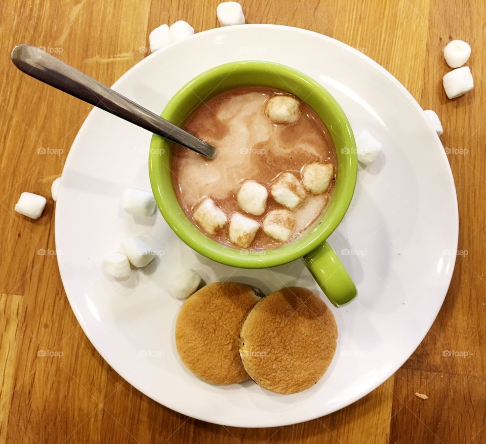 Warm milk in a green mug. Keeping warm this winter 