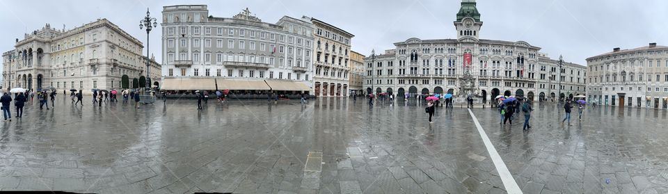 Day time in the city of Trieste, Italy in wet rainy weather shot with wide angle lens