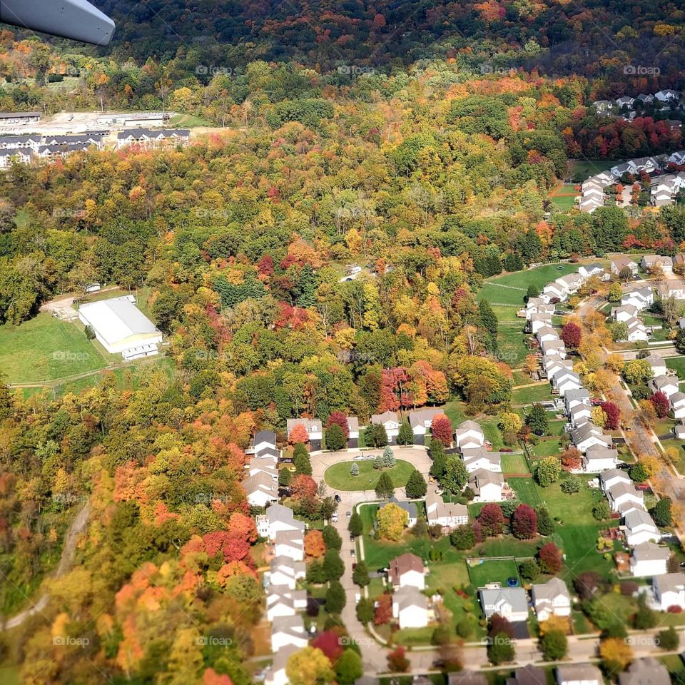 Fall colors on full display while passing over a neighborhood on final approach in Columbus Ohio
