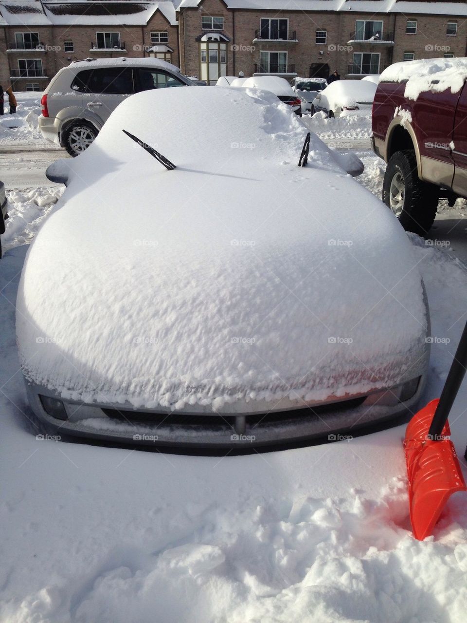 Trouble Driving!. Car after a strong winter storm. A full day of shoveling ahead!