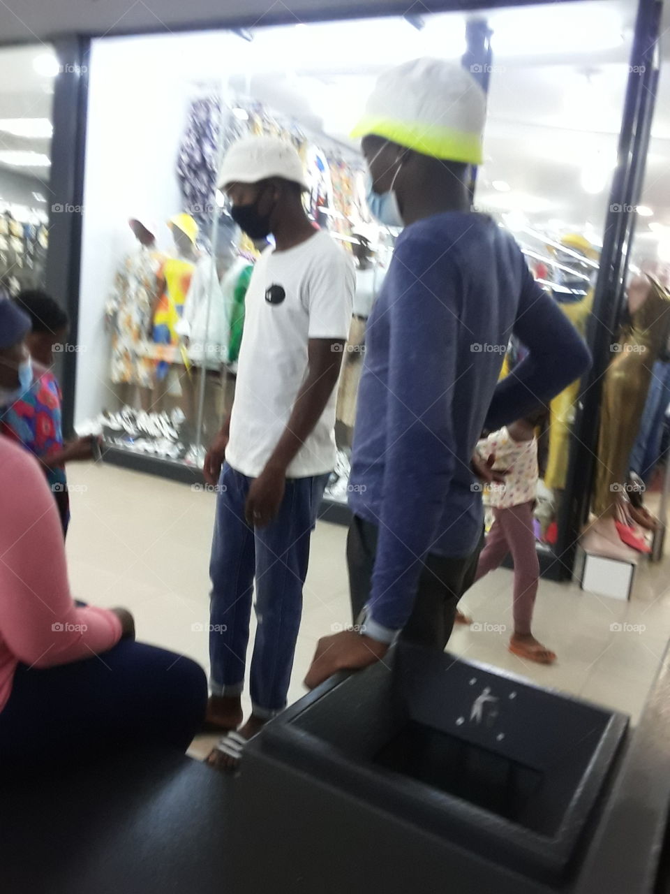 Men and woman chatting at the walkway