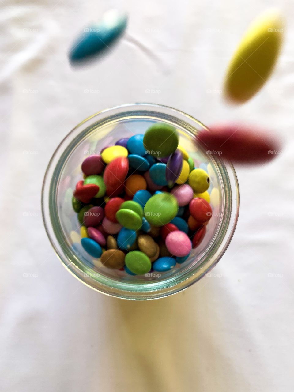 Clash of colours. Got to love the colourful smarties brighting up the container