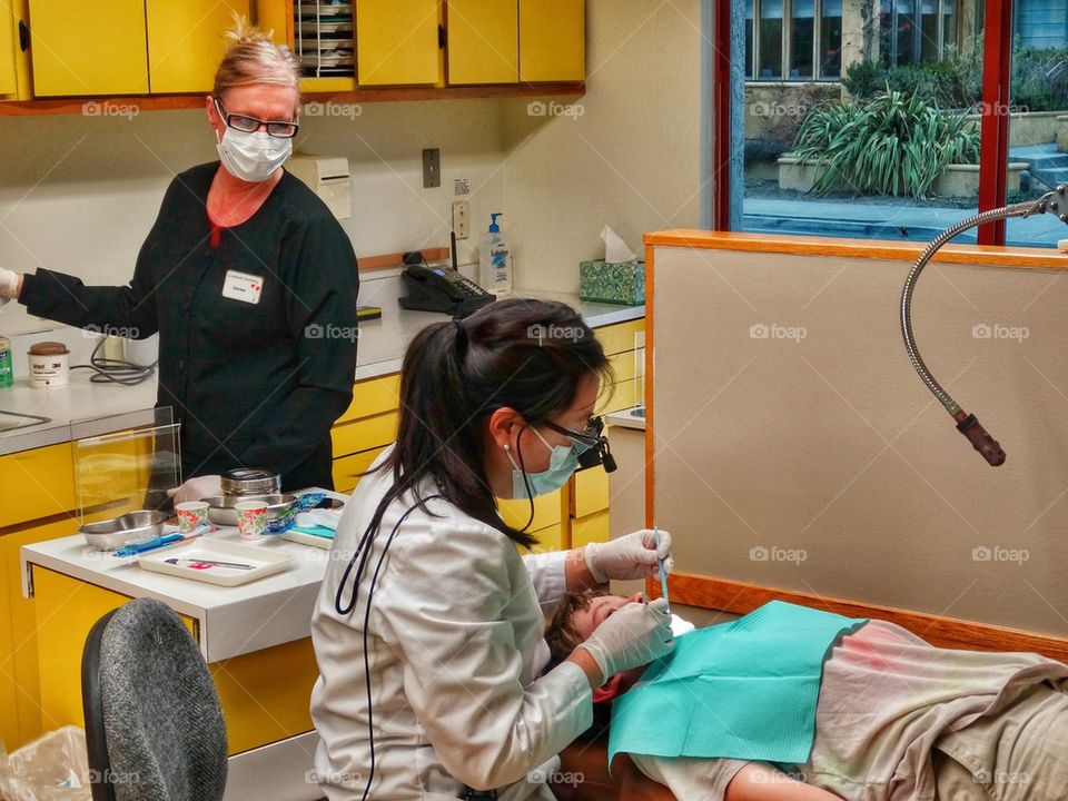 First Visit To The Dentist For A Brave Boy. Brave Boy Getting A Dental Procedure
