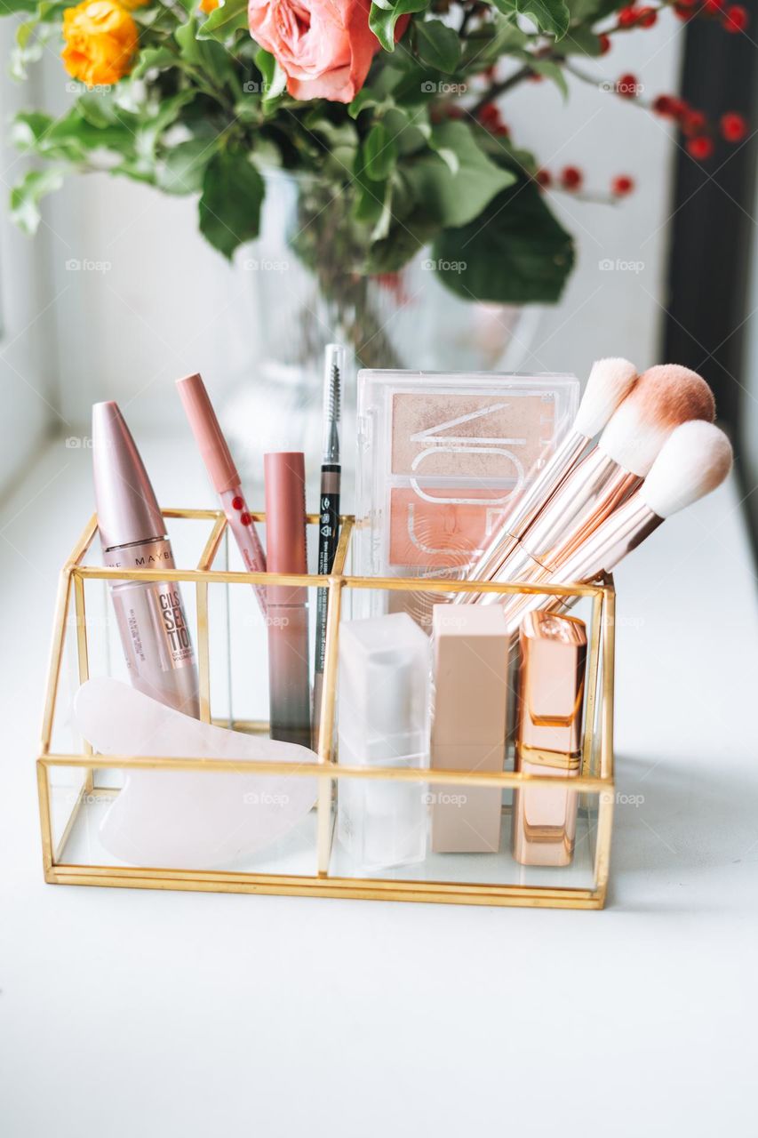 Makeup products on window sill