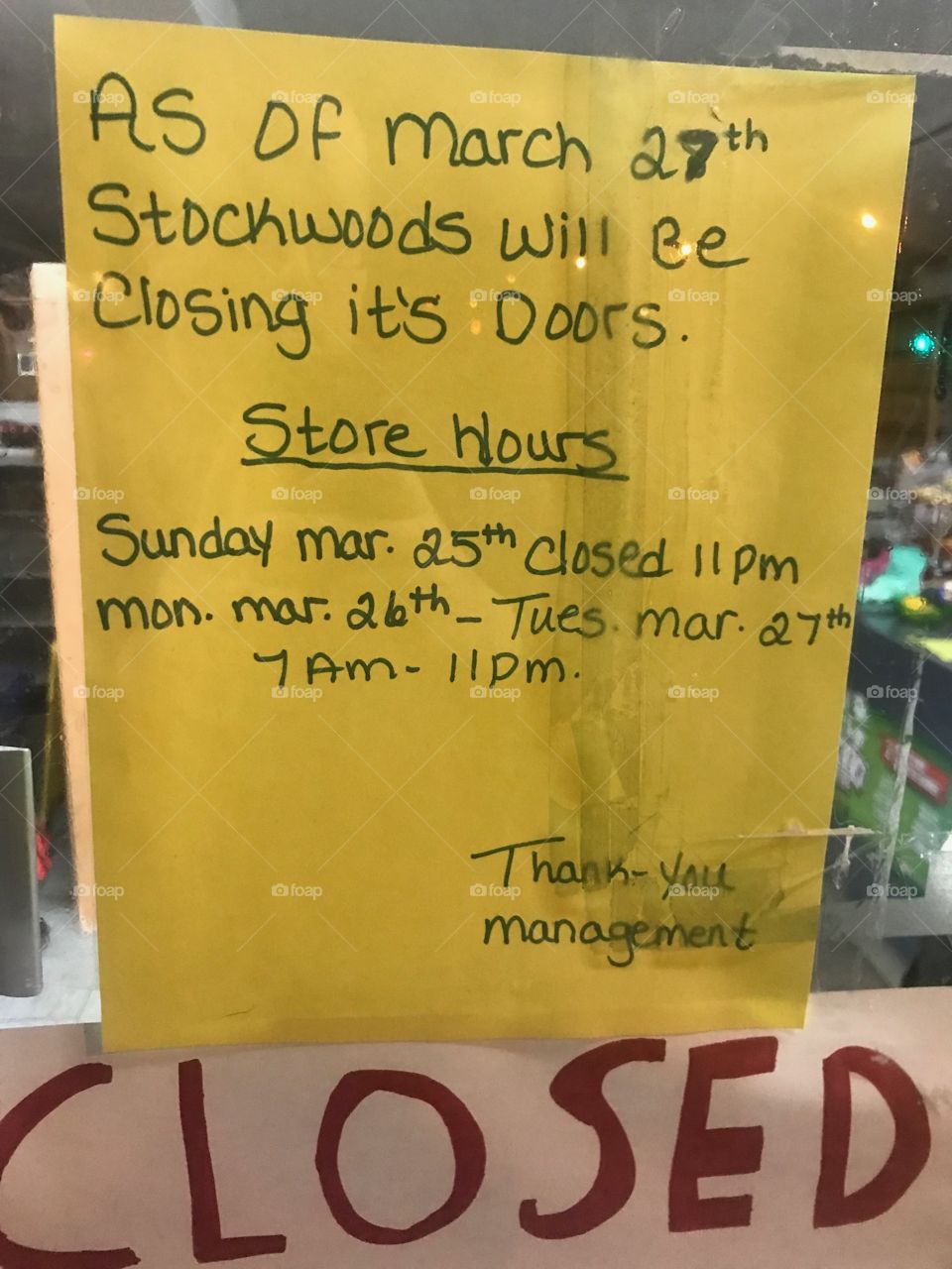 This is a letter in the window advising customers of the impending closure of stockwoods convenience store. It indicates the hours for the liquidation sale 