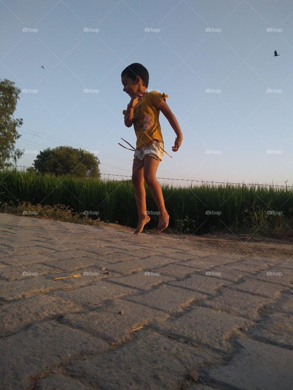 a girl jumping high without protection.