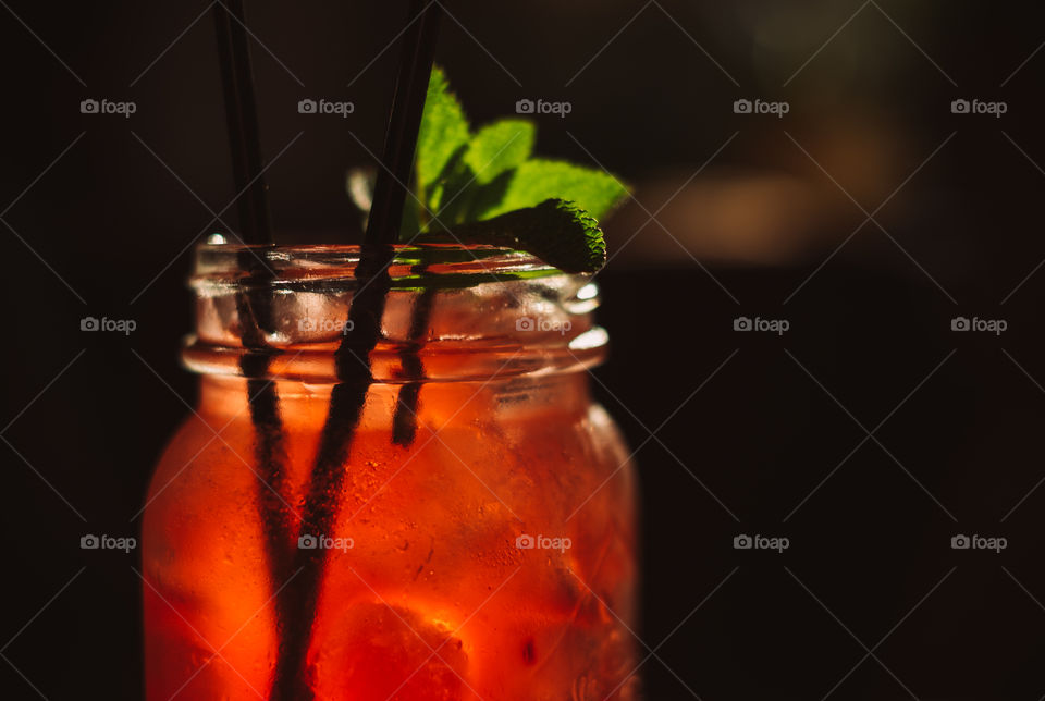 Cranberry cocktail with leaves of mint