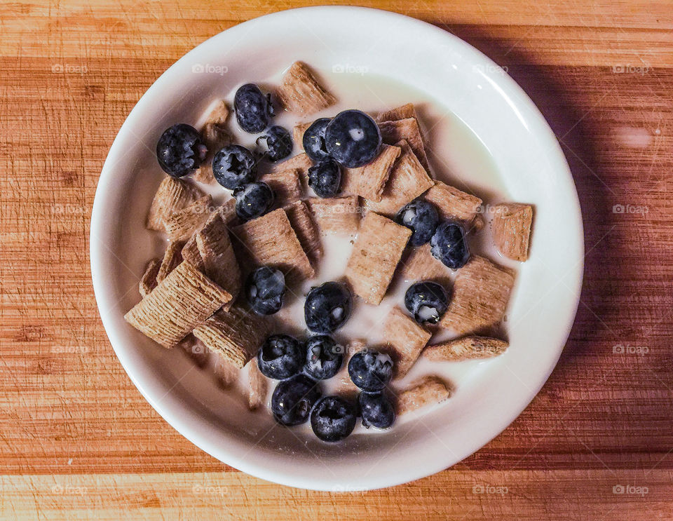 Healthy breakfast shredded wheat with blueberries 