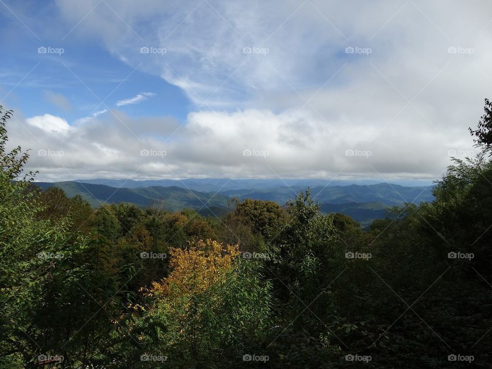 Mountain view under cloudy skies 