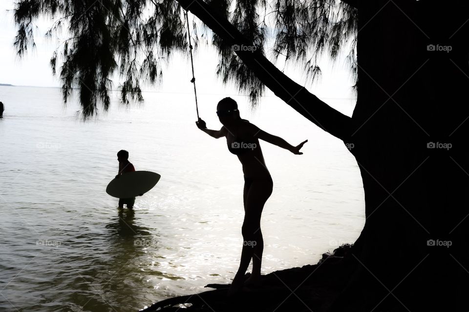 Rope swing & surfer