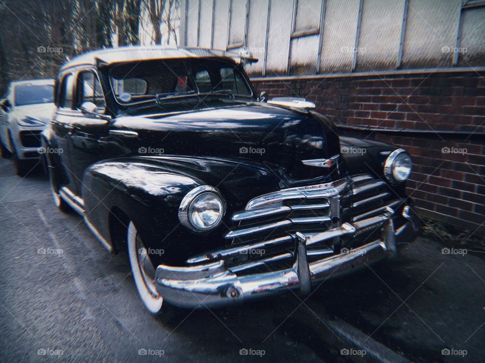 Black vintage car parked on the street