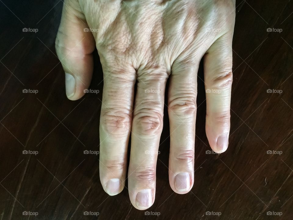 Close up aging female hand
