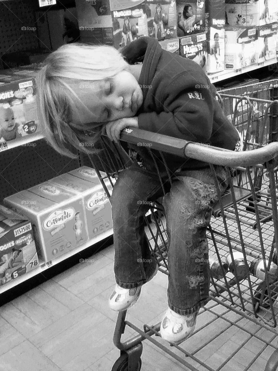 asleep in grocery cart