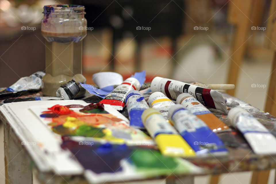 Paints and a palette ready to be used by an artist in the studio