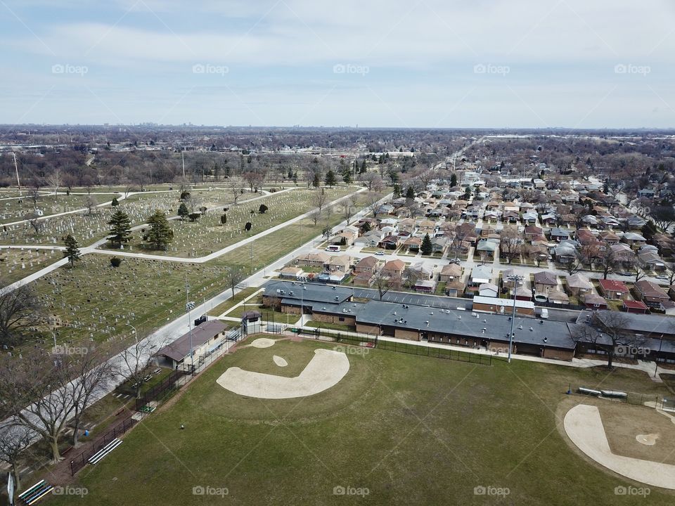 Chicago Suburb By Drone With City Skyline Deep In The Background