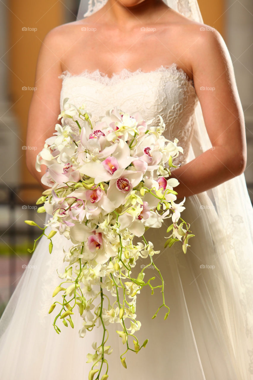 Long flower bouquet and bride