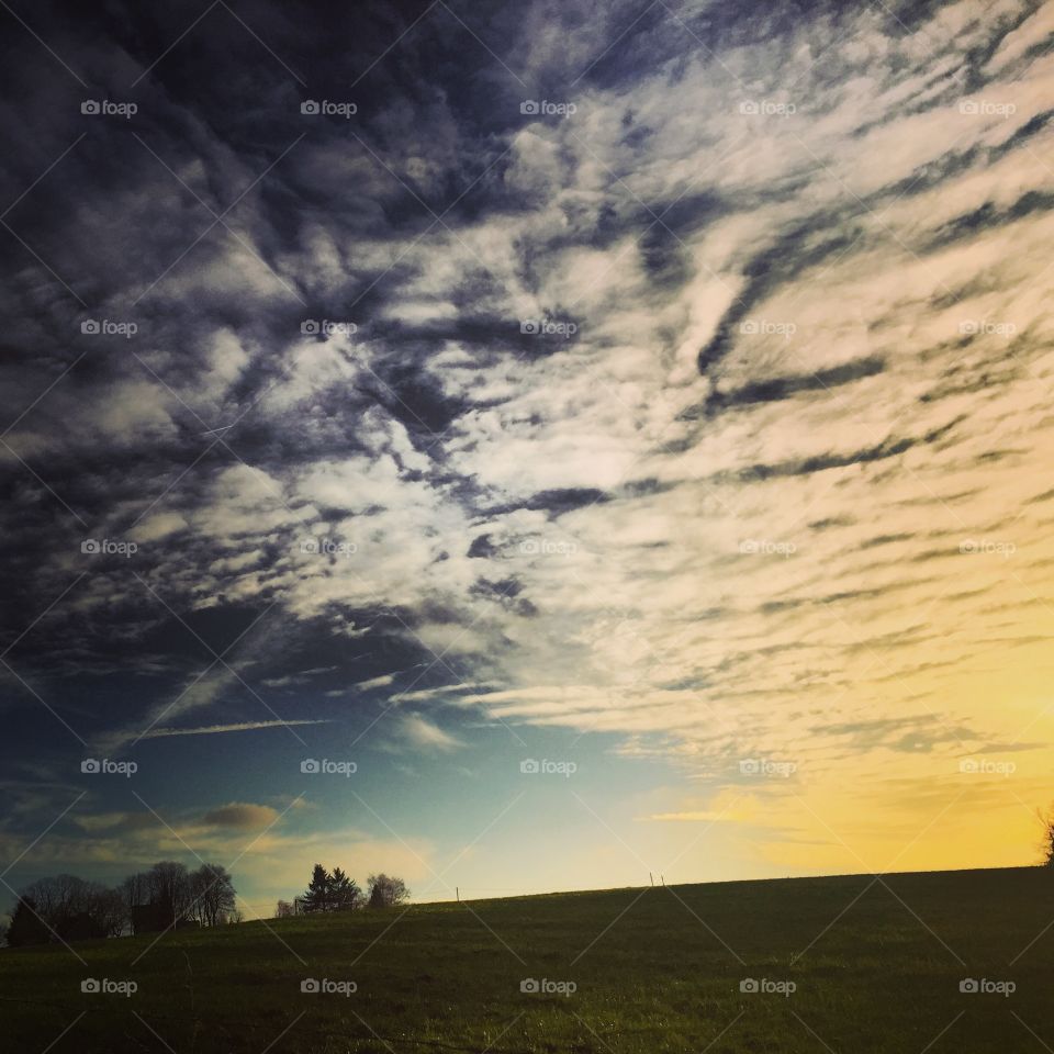 Cloudscape over field