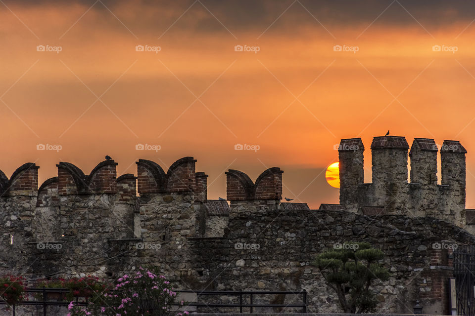 Sun rising beyond the walls of the castle