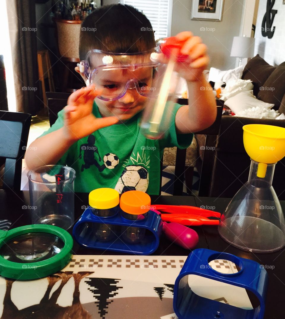 Playing Mad scientist. My godson practicing being a chemist 