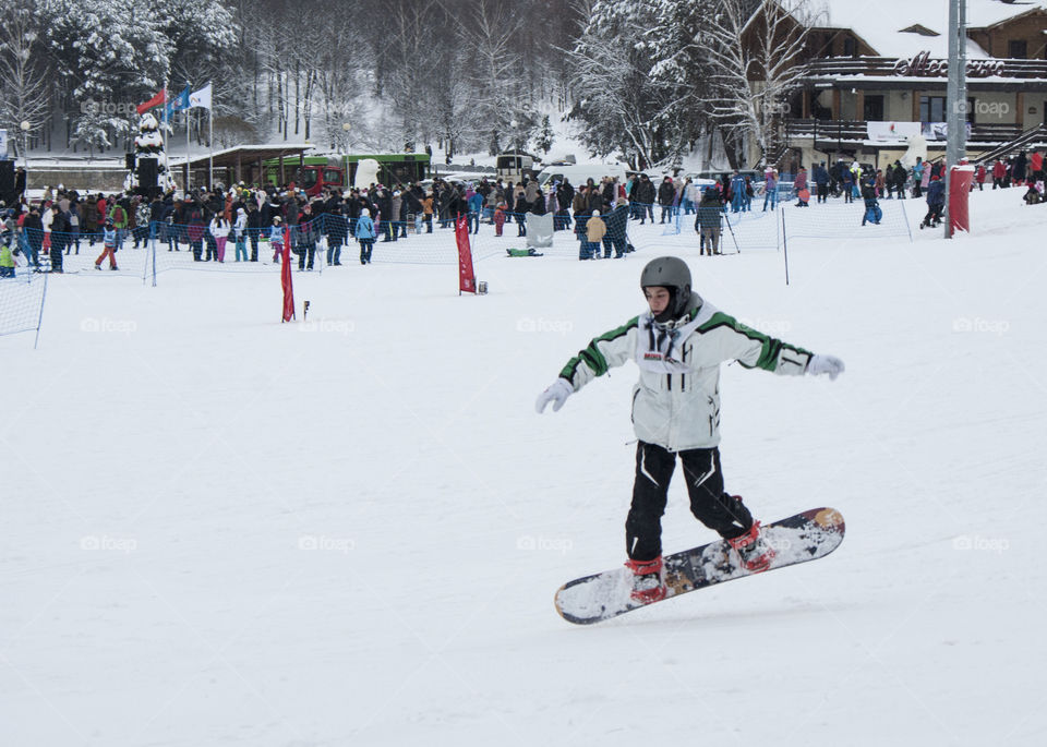 winter holidays. skating on dogs, sledding, snowboarding,