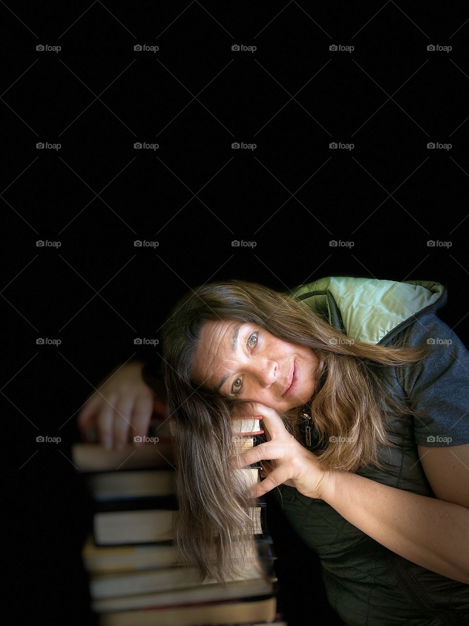 iPhone portrait - woman with book stack.