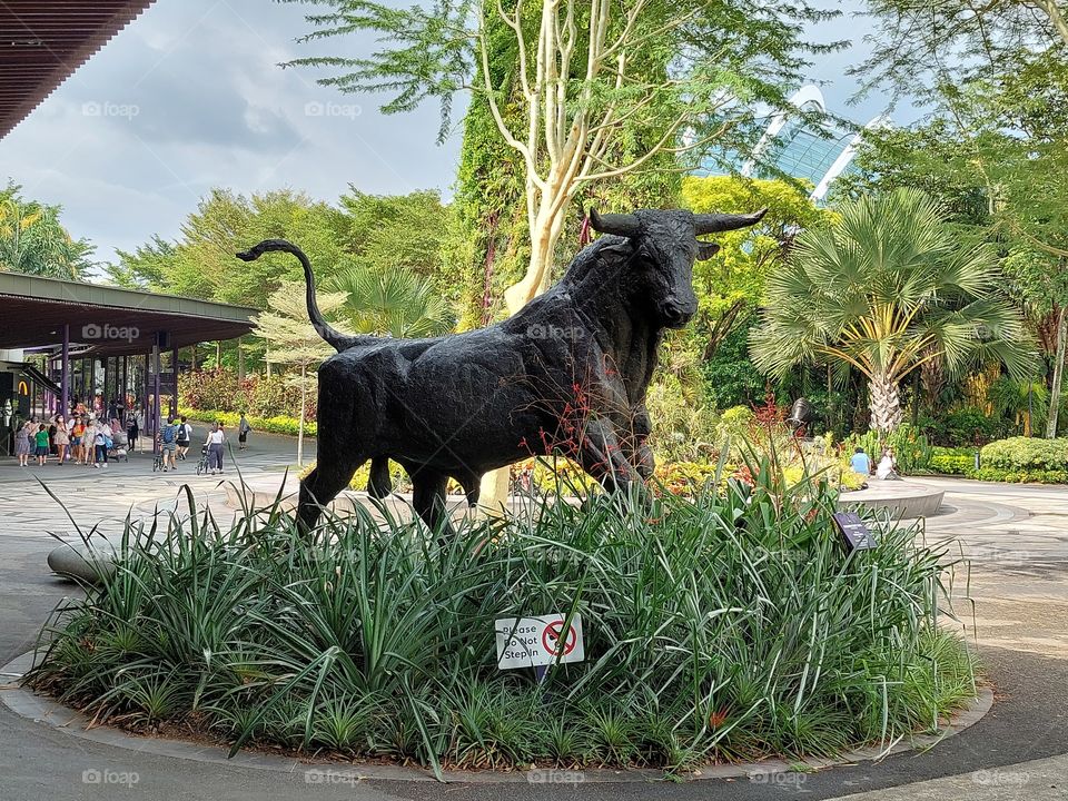 a statue bull in singapore garden by the bay