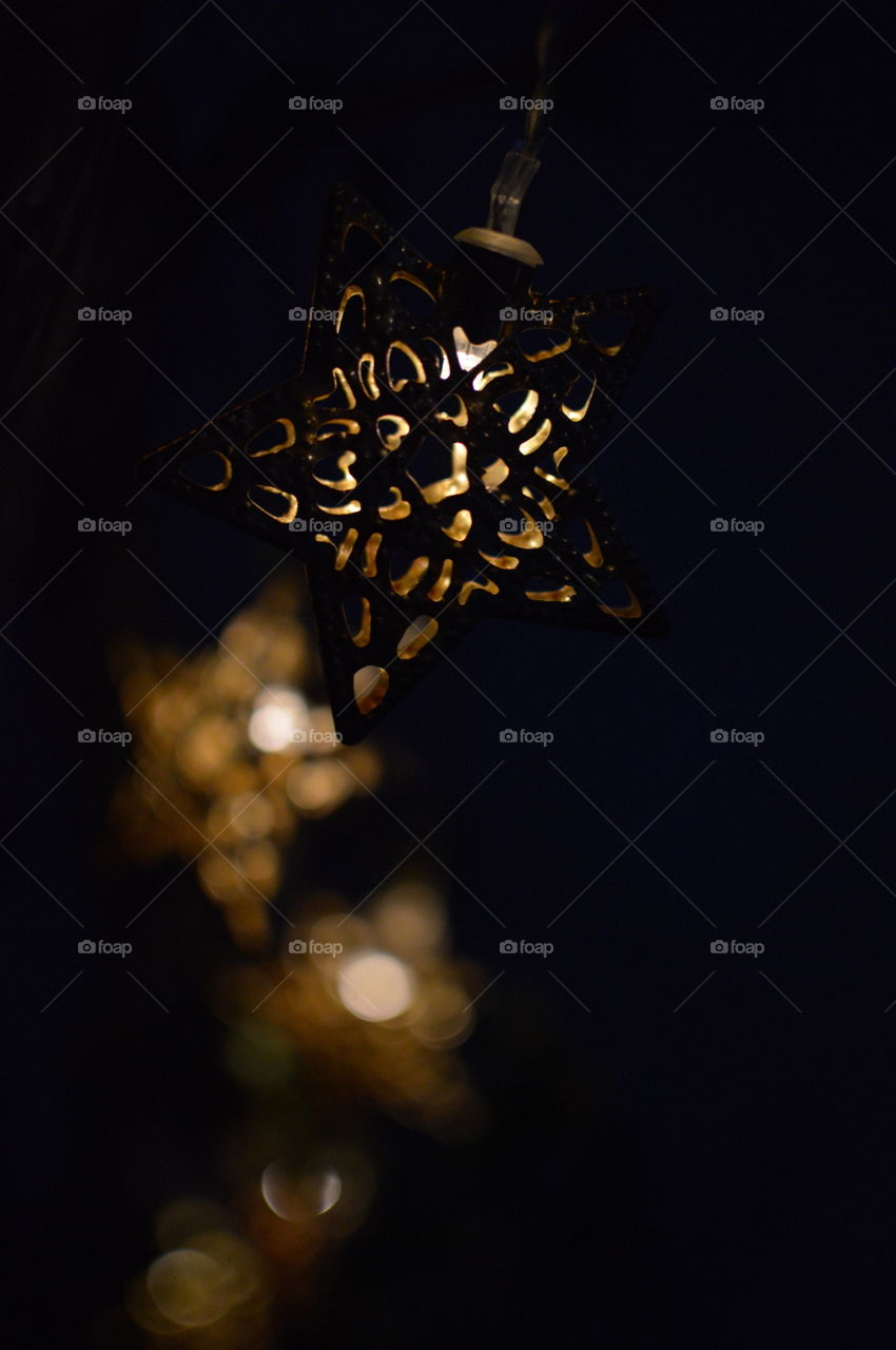 Surreal star with bokeh blur in background.