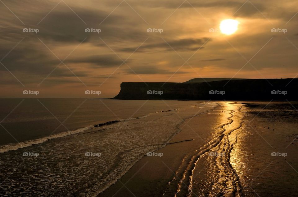 Sunrise over sea cliffs