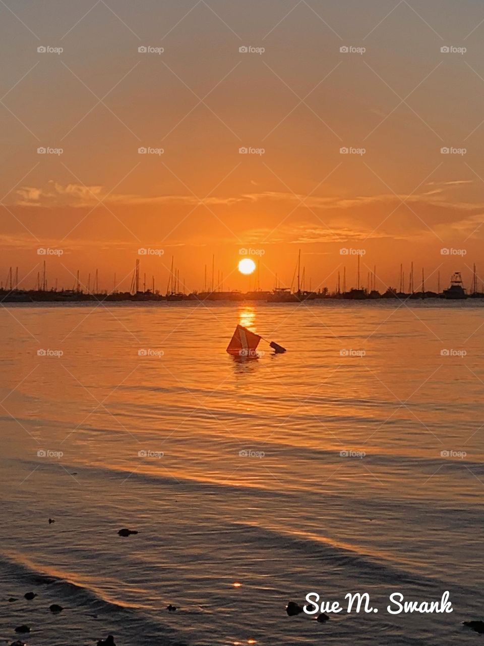 DIVERS FLAG DURING SUNSET