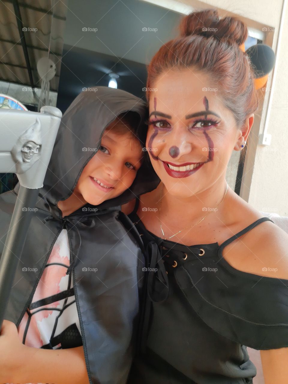 cute boy and mother dressed in halloween theme