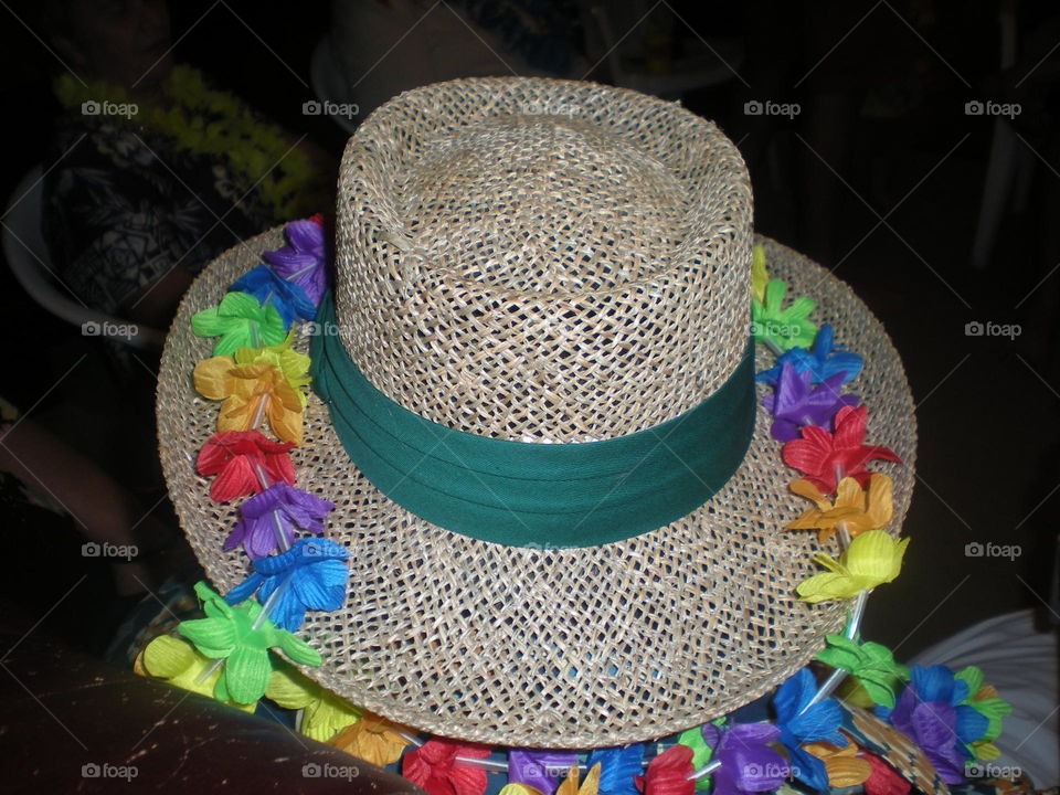 party hat. wicker hat with plastic lei