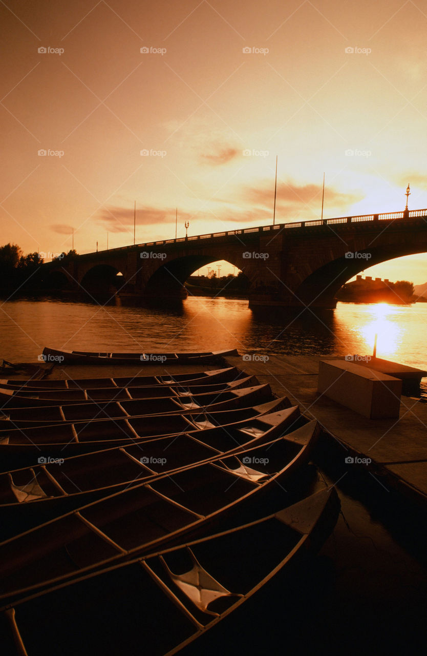 London bridge in Lake Havasu city of Arizona is silhouette to a beautiful evening sunset.