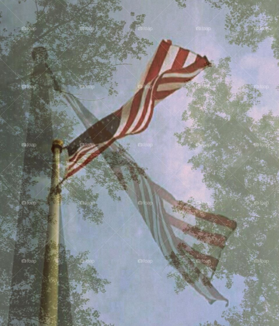 American Flag Gently Waving. Triple overlay against the sky.