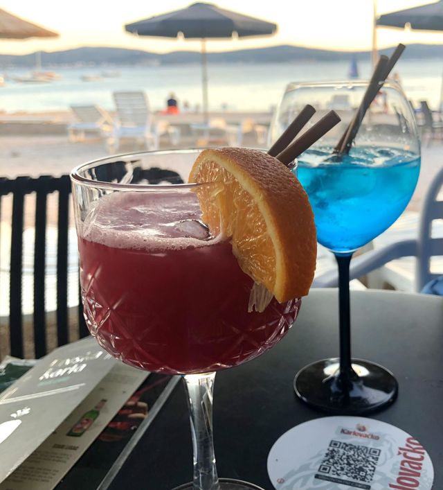 Enjoying fine blue and red cocktails