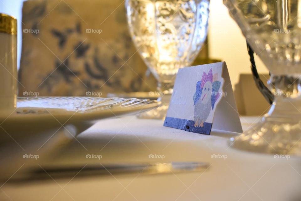 Place card on dinner table set for Thanksgiving holiday feast 