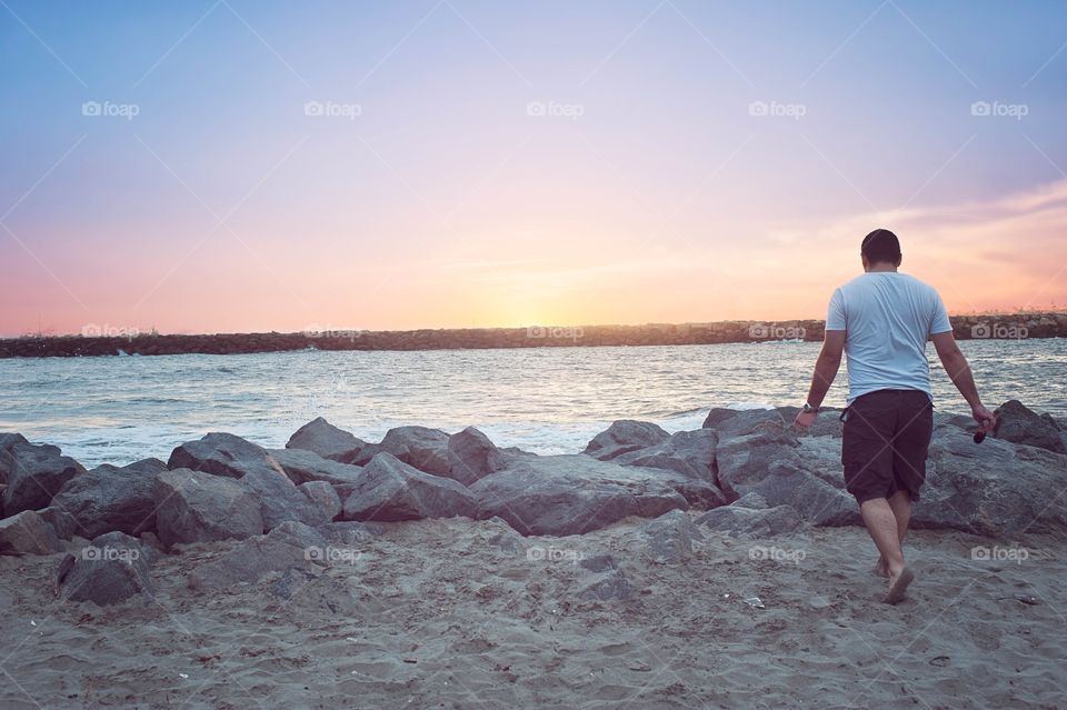 Man walking at beach